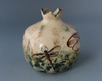Pomegranate with dragonflies